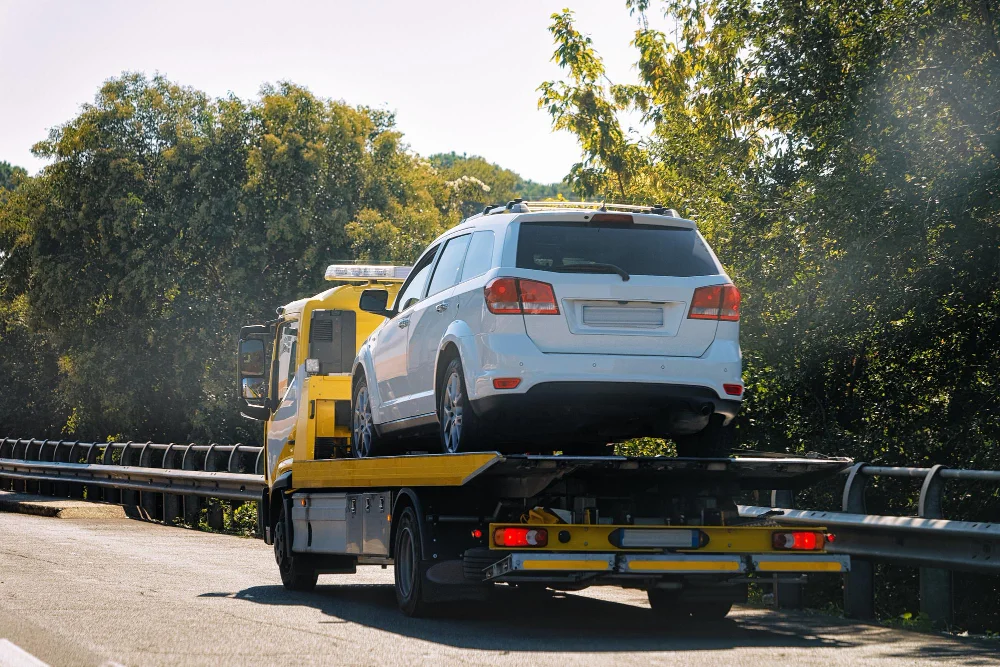 tow-truck-with-car-road